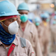 A new normal: Covid-19 temperature checks for migrant laborers.